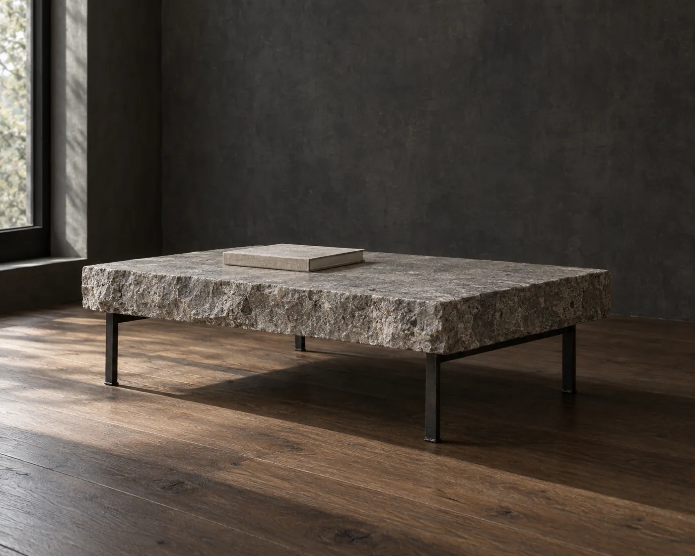 The Drystone Coffee Table — Split-face limestone slab · flat-bar steel base